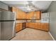 Well-equipped kitchen featuring stainless steel appliances, granite countertops, and ample cabinet space at 1043 Sugar Pike Way, Canton, GA 30115