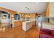 Spacious kitchen featuring a center island, stainless appliances, and hardwood floors at 1043 Sugar Pike Way, Canton, GA 30115