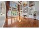 Spacious living room with soaring ceilings, large windows, a fireplace and hardwood floors at 1043 Sugar Pike Way, Canton, GA 30115