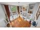Aerial view of the living room featuring a fireplace, built-ins, hardwood floors and tall windows at 1043 Sugar Pike Way, Canton, GA 30115