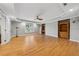 Spacious living room features wood floors, ceiling fan, built-in bookshelves, recessed lighting, and large window at 1043 Sugar Pike Way, Canton, GA 30115