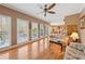 Cozy living room with large windows, hardwood floors, and a comfortable seating area at 1043 Sugar Pike Way, Canton, GA 30115