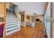 Spacious living area with staircase, ceiling fan, and hardwood floors throughout at 1043 Sugar Pike Way, Canton, GA 30115