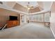 Large main bedroom featuring tray ceiling, carpet floors and a large window view at 1043 Sugar Pike Way, Canton, GA 30115