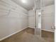 Spacious walk-in closet with carpet and ample shelving for optimal storage solutions at 1043 Sugar Pike Way, Canton, GA 30115