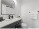 Well-lit bathroom features a single sink vanity, a large mirror, and a shower with a curtain at 112 Timber Mist Ln, Lawrenceville, GA 30045