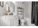 Well-appointed full bathroom with vanity, tub-shower, and modern black accents at 112 Timber Mist Ln, Lawrenceville, GA 30045
