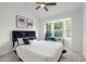 Inviting bedroom with large bay window, soft carpet, and modern ceiling fan at 112 Timber Mist Ln, Lawrenceville, GA 30045