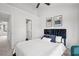 Bright bedroom boasts two art pieces above the dark headboard and ensuite bathroom at 112 Timber Mist Ln, Lawrenceville, GA 30045