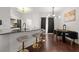 Contemporary kitchen and dining area with stylish lighting, a breakfast bar, and elegant finishes at 112 Timber Mist Ln, Lawrenceville, GA 30045