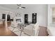 Elegant living room with a fireplace, modern furniture, and large windows that provide abundant natural light at 112 Timber Mist Ln, Lawrenceville, GA 30045