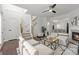Cozy living room featuring hardwood floors, a fireplace, and an open staircase, creating an inviting atmosphere at 112 Timber Mist Ln, Lawrenceville, GA 30045