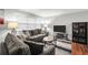 Living room with hardwood floors, neutral paint, a large comfy gray sofa, and natural light at 1683 Briarcliff Rd # 6, Atlanta, GA 30306