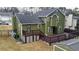 Two-story home boasts a backyard deck, surrounded by a well-kept yard and a storage shed, with ample space to enjoy at 2102 Bedford Ct, Lithonia, GA 30058