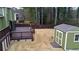Spacious backyard with a wooden deck, a storage shed, and a well-maintained lawn, perfect for outdoor activities at 2102 Bedford Ct, Lithonia, GA 30058