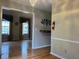 Open dining room with hardwood floors and chandelier at 2102 Bedford Ct, Lithonia, GA 30058