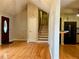 Entryway with stairs, hardwood floors, and a view of the kitchen at 2102 Bedford Ct, Lithonia, GA 30058