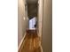 Hallway with hardwood floors leading to the interior of the house at 2102 Bedford Ct, Lithonia, GA 30058