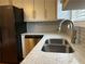 Modern kitchen with stainless steel appliances, light backsplash and grey granite countertops at 2102 Bedford Ct, Lithonia, GA 30058