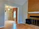 Living room with stone fireplace and view of the dining room at 2102 Bedford Ct, Lithonia, GA 30058