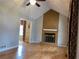 Living room features hardwood floors and a stone fireplace at 2102 Bedford Ct, Lithonia, GA 30058