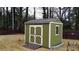 Exterior view of the backyard shed with double doors at 2102 Bedford Ct, Lithonia, GA 30058