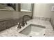 Modern bathroom sink with brushed nickel faucet and speckled granite countertop at 2102 Bedford Ct, Lithonia, GA 30058