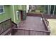 Expansive wooden deck with multiple levels and railings offers ample space for outdoor enjoyment and entertaining at 2102 Bedford Ct, Lithonia, GA 30058