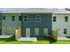 View of the backyard featuring a well-maintained lawn, fenced patios, and exterior walls at 344 Sinclair Ct # 74, Mcdonough, GA 30253