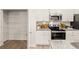 Well-equipped kitchen features granite countertops, modern appliances, subway tile backsplash, and a spacious pantry at 344 Sinclair Ct # 74, Mcdonough, GA 30253