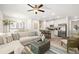 Inviting living space featuring a comfortable sectional sofa, stylish decor, an open floor plan, and a ceiling fan at 344 Sinclair Ct # 74, Mcdonough, GA 30253