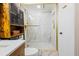 Modern bathroom featuring a marble shower with gold hardware and custom vanity at 1 Biscayne Nw Dr # 804, Atlanta, GA 30309