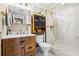 Updated bathroom featuring a modern vanity, a toilet, and a luxurious glass-enclosed shower at 1 Biscayne Nw Dr # 804, Atlanta, GA 30309