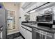 The updated kitchen features modern appliances, including a microwave and stainless steel appliances at 1 Biscayne Nw Dr # 804, Atlanta, GA 30309
