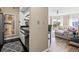 Open-concept kitchen with stainless appliances flows into a living area with balcony access at 1 Biscayne Nw Dr # 804, Atlanta, GA 30309