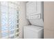 Efficient laundry area featuring a stacked washer and dryer unit at 1 Biscayne Nw Dr # 804, Atlanta, GA 30309
