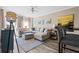 Comfortable living room with a large sectional sofa, stylish floor lamp, and neutral decor at 1 Biscayne Nw Dr # 804, Atlanta, GA 30309