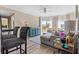 Bright living room featuring stylish furnishings, a ceiling fan, and sliding glass doors to a private balcony at 1 Biscayne Nw Dr # 804, Atlanta, GA 30309