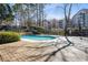 Inviting community pool with surrounding wooden deck, perfect for swimming and lounging in a serene environment at 1 Biscayne Nw Dr # 804, Atlanta, GA 30309
