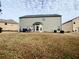 Spacious backyard showcasing a patio, perfect for outdoor entertaining at 1291 Vienna Ct, Hampton, GA 30228