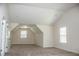 Bedroom with neutral carpet, vaulted ceilings and large windows provides ample room and natural light at 1291 Vienna Ct, Hampton, GA 30228