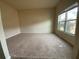 Bright, carpeted bedroom with a large window offering natural light at 1291 Vienna Ct, Hampton, GA 30228