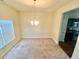 Dining room with carpet flooring and a chandelier at 1291 Vienna Ct, Hampton, GA 30228