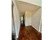 Hallway featuring hardwood floors and neutral walls at 1291 Vienna Ct, Hampton, GA 30228