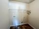 Laundry room with a shelf that can be used to hang clothes or store items that are needed in the laundry at 1291 Vienna Ct, Hampton, GA 30228