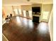 Bright living room featuring a fireplace, hardwood floors, and large windows at 1291 Vienna Ct, Hampton, GA 30228