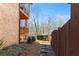 Charming backyard with a brick facade and a wooden fence at 230 Society St, Alpharetta, GA 30022