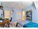 Bedroom featuring sloped ceiling, decorative rug, shelving and adjacent bathroom at 230 Society St, Alpharetta, GA 30022