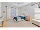 Cozy bedroom with a twin bed, white linens, and a soft blue throw at 230 Society St, Alpharetta, GA 30022