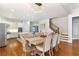 Elegant dining area adjacent to the kitchen, featuring hardwood floors and stylish decor at 230 Society St, Alpharetta, GA 30022